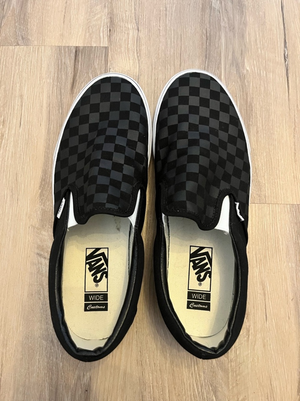 Vans Black Checkerboard Slip-On Sneakers